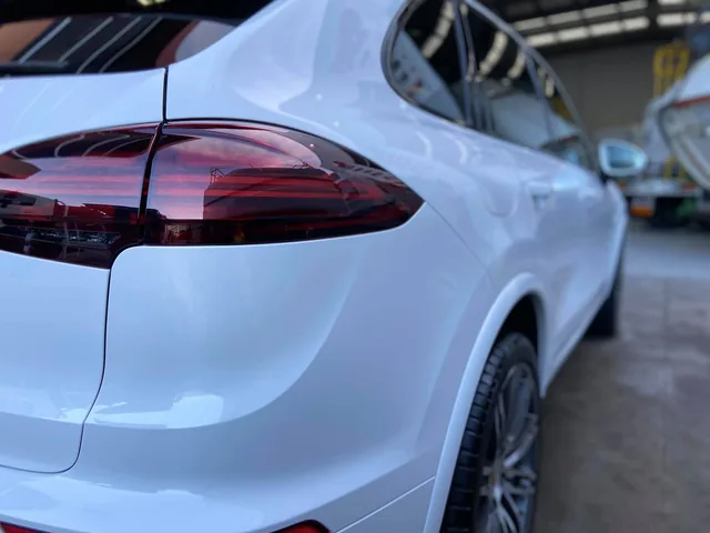 White Porsche Cayenne rear quarter after treatment