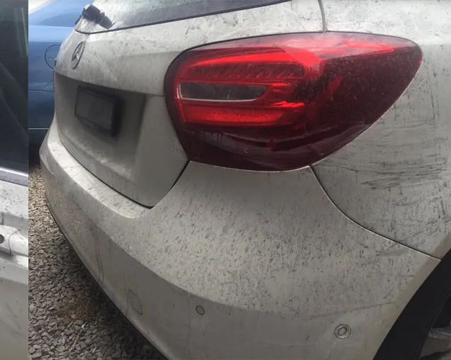 Fallout detail across the Mercedes tail light and panel