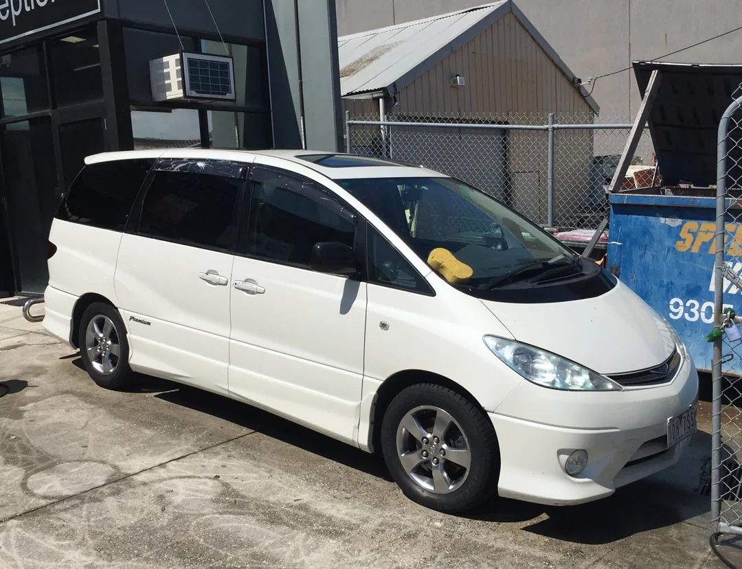 The same Toyota van after overspray removal, paint clean and undamaged