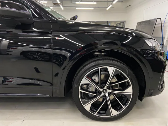 Black SUV restored to gloss after fallout removal