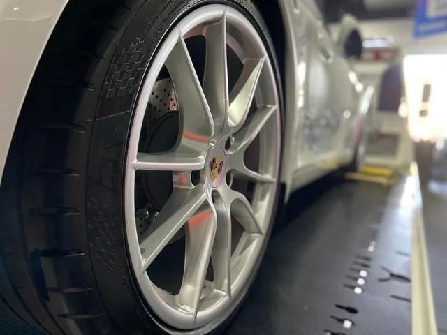 Alloy wheel and guard cleaned of overspray